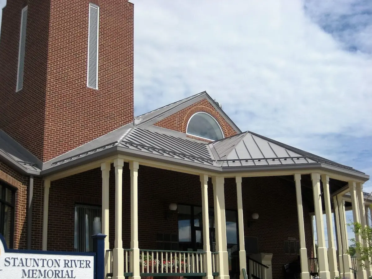 Skilled roofing craftsmen working on a residential roof in Mount Airy